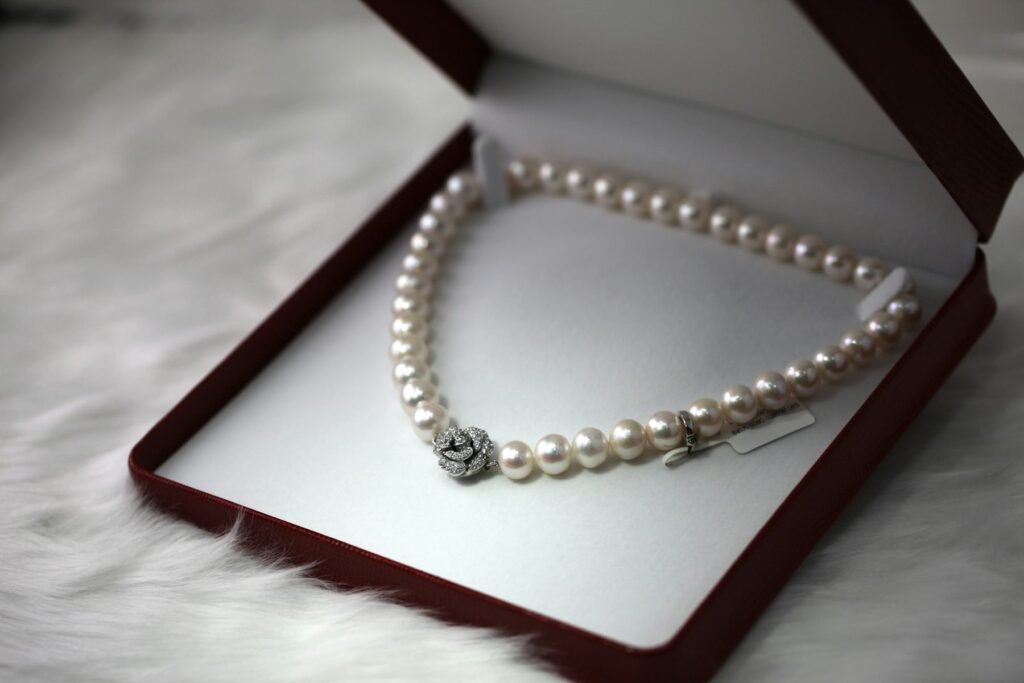 A pearl necklace in an open gift box